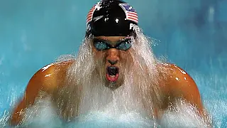 Phelps comemora com o filho a segunda medalha de ouro